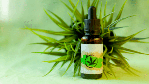 Cannabis tincture on green background
